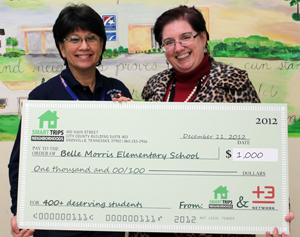 Terry Lynn Hursey, principal of Belle Morris Elementary School accepts the check